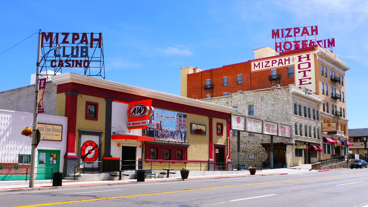 Wider street-corner view showing the Mizpah Club Casino storefront and the hotel tower behind it, Main Street, Tonopah.
