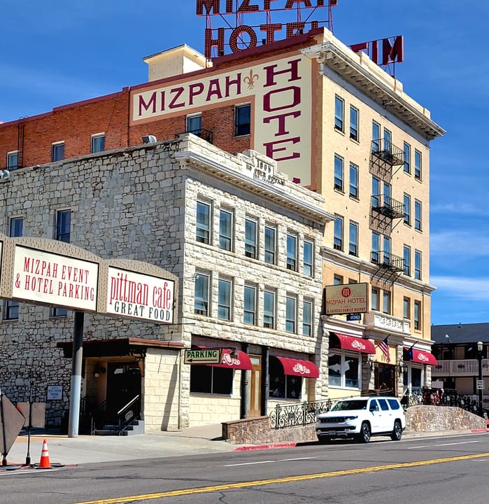 Recent (2024) street-level photo of the Mizpah Hotel's Main Street facade, Pittman Cafe storefront visible at ground level.
