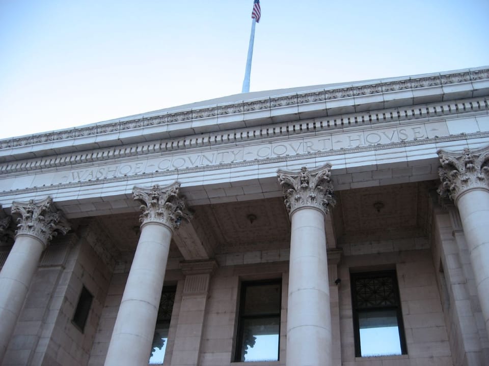Detail of the Corinthian columns and entablature reading '...S COUNTY COURT HOUSE' on the Washoe County Courthouse, Reno, Nevada, 2008.