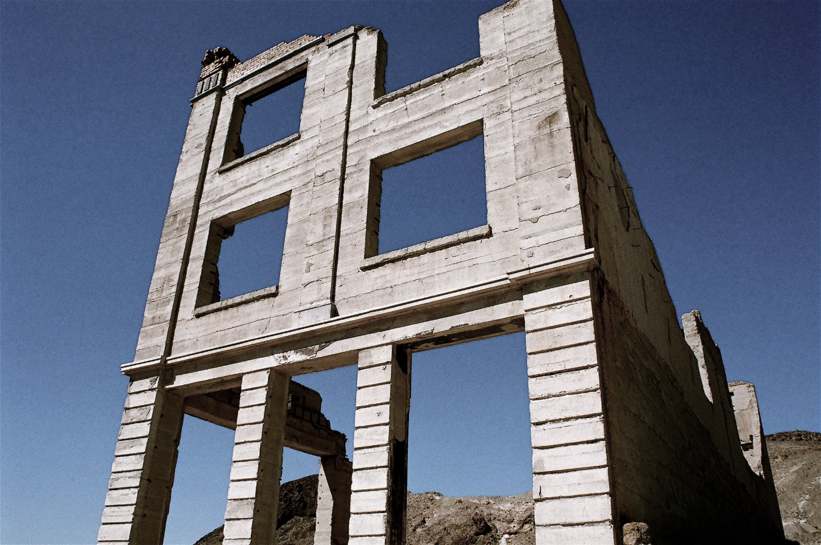 Ruins of the three-story Cook Bank building standing in the Nevada desert at the Rhyolite ghost town
