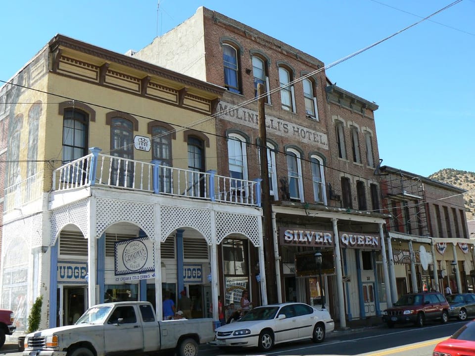 The Silver Queen Hotel and its 'Molinelli's Hotel' painted lettering on C Street, Virginia City, seen at an angle with the white-balconied neighbouring building at left, July 2007.