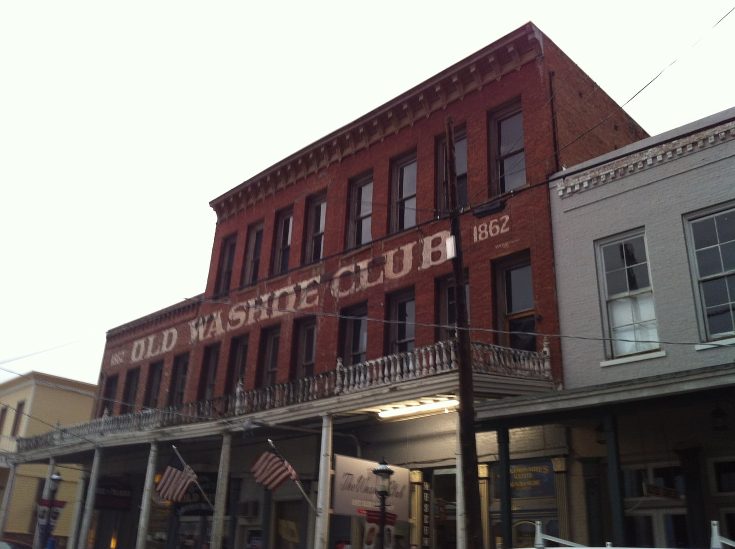 Brick facade of the Old Washoe Club saloon and museum on C Street in Virginia City, Nevada
