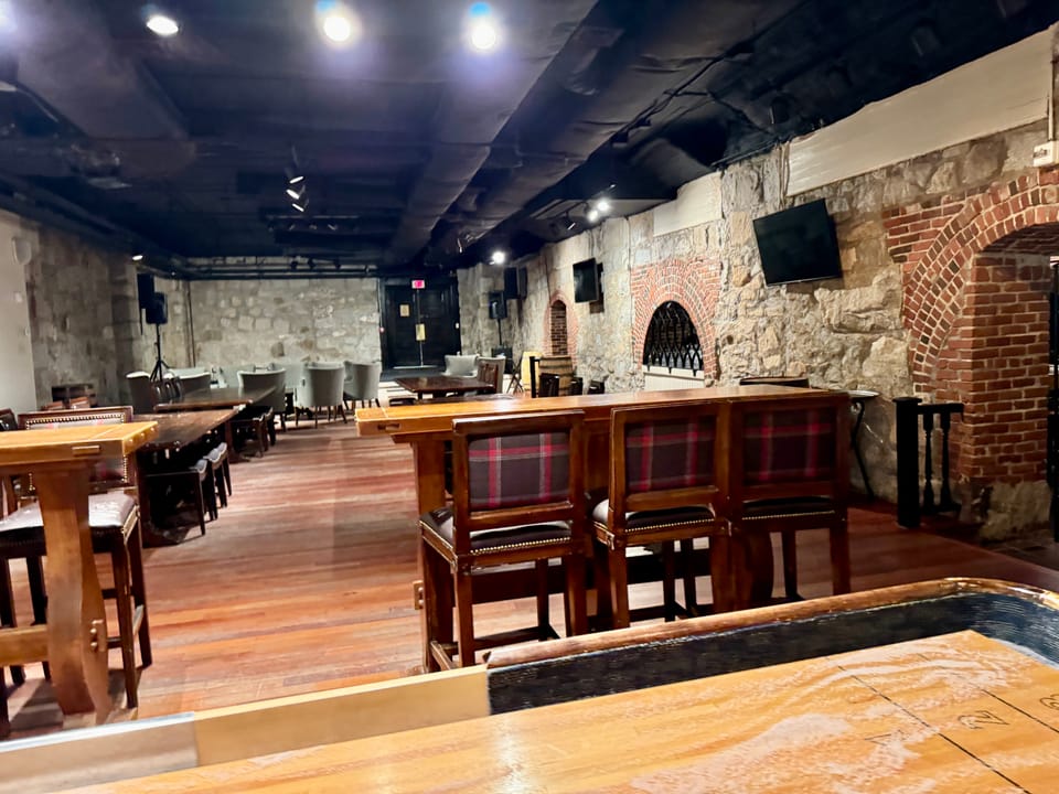 The Cave, the hotel's stone-walled cellar tavern with exposed brick arches, Bretton Woods, NH.