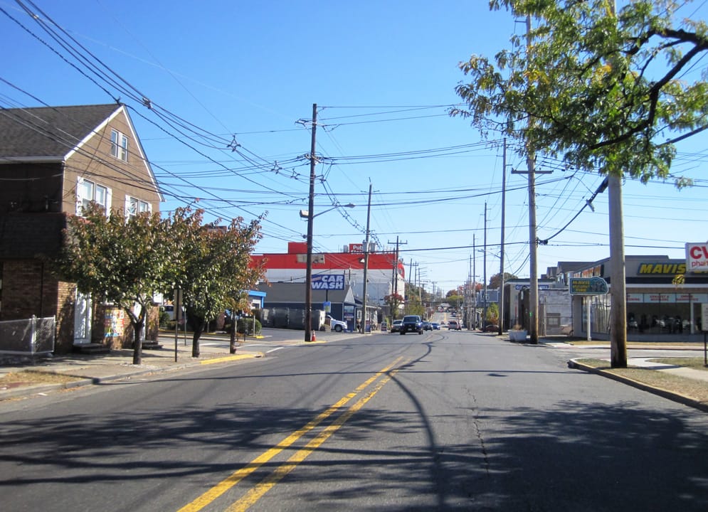 Photo of eastbound County Route 120 (Paterson Avenue) on the border of East Rutherford (south/right) and Wallington (north/left) in Bergen County, New Jersey. Photo taken looking east-southeast between Morrisse Avenue and Jordan Avenue / Willow Street.
