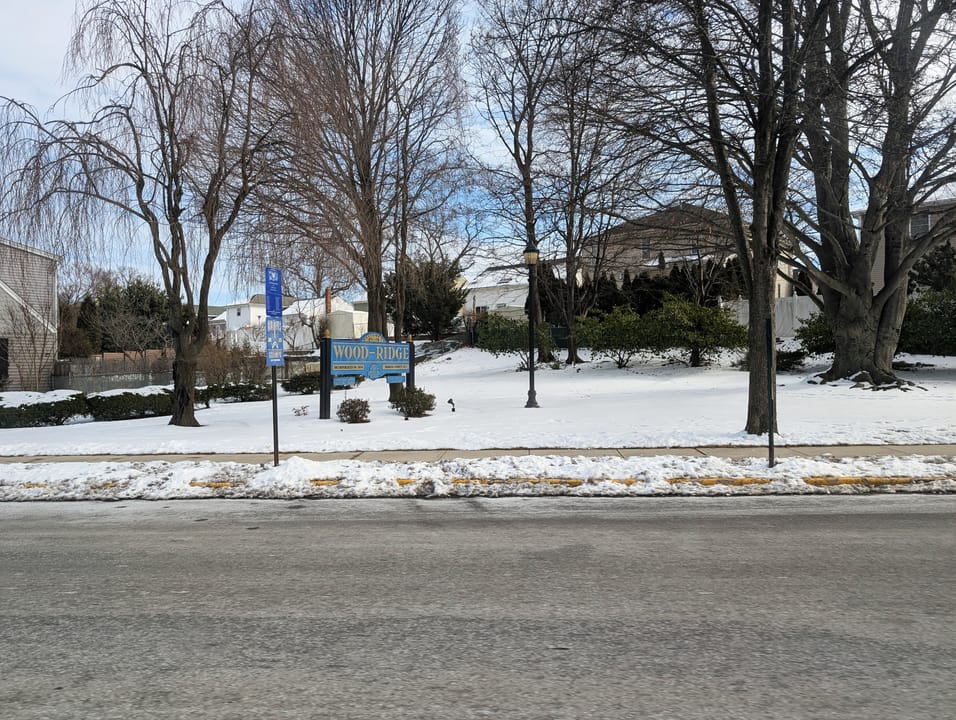 Photo of a welcome sign for Wood-Ridge, New Jersey heading northbound along County Route 57 (4th Street). Photo taken looking east.
