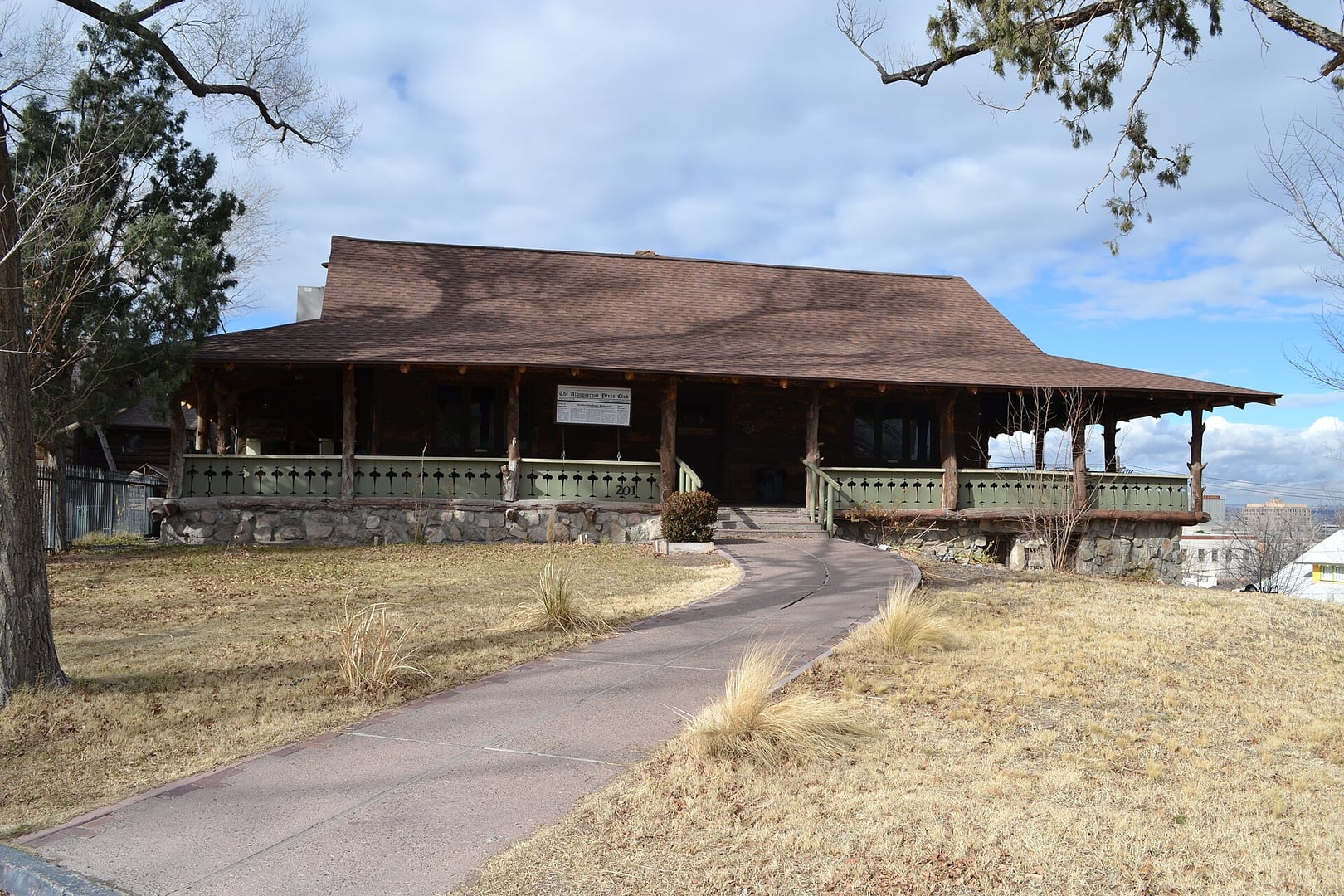 Three-story log-and-stone Norwegian Vernacular Whittlesey House at 201 Highland Park Circle SE in Albuquerque, New Mexico, now the Albuquerque Press Club