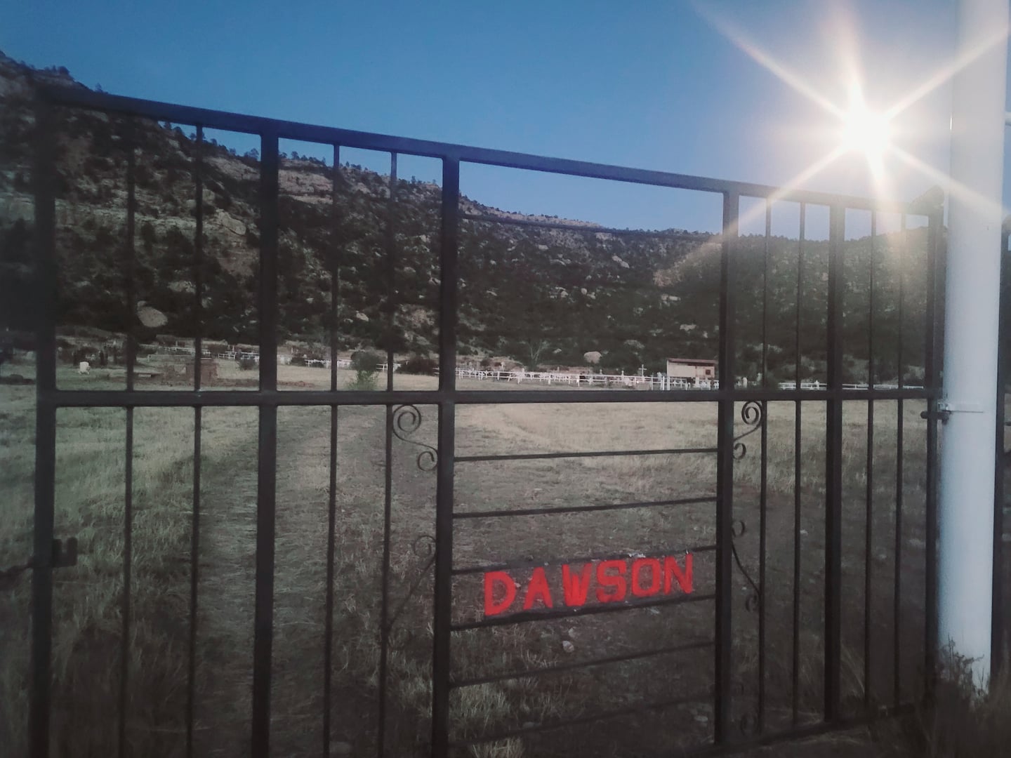 Iron gates at the entrance to Dawson Cemetery in Colfax County, northeast New Mexico, a National Register-listed mining-town cemetery.