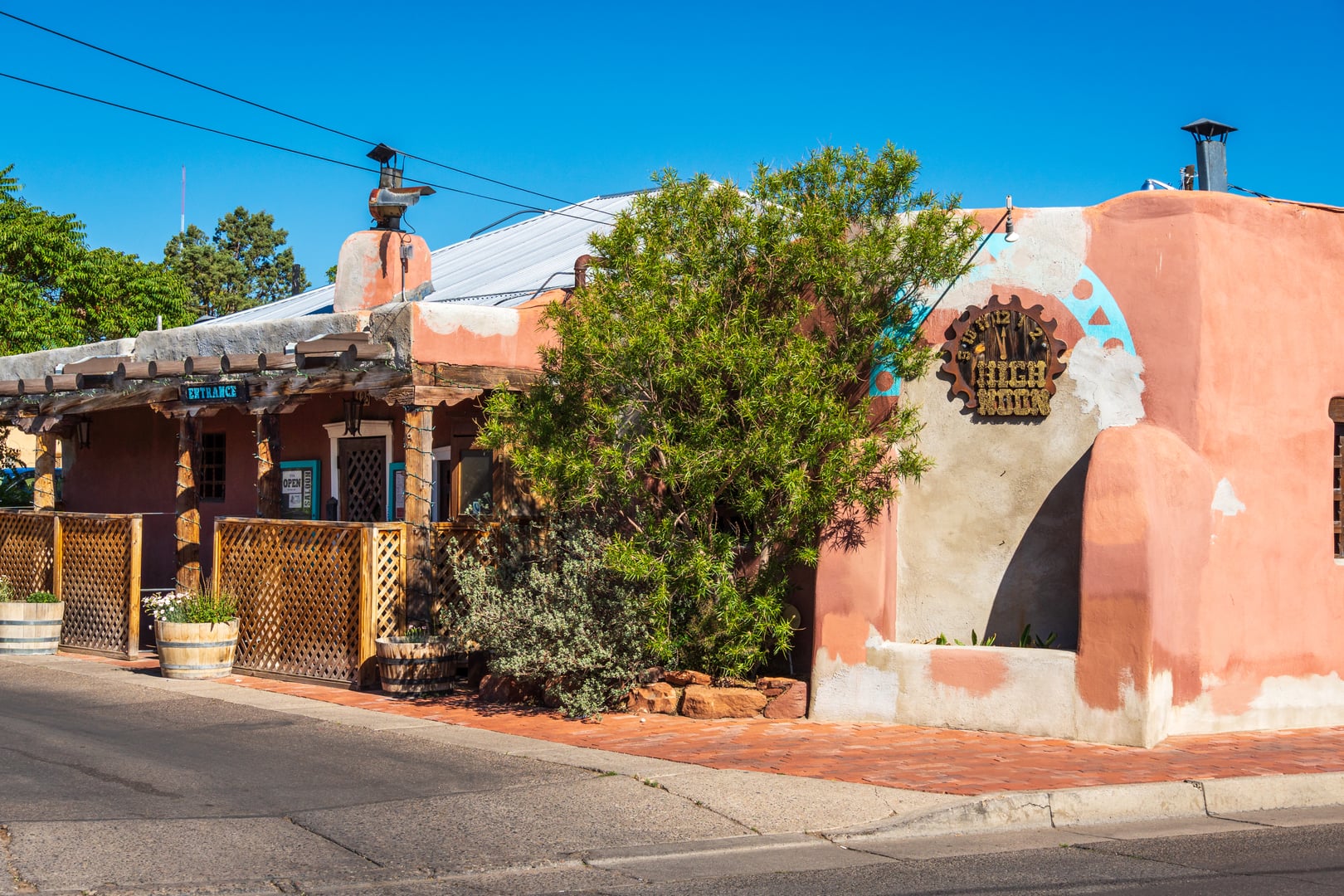 Adobe exterior of the High Noon Restaurant & Saloon at 425 San Felipe Street NW in Old Town Albuquerque, New Mexico, photographed in 2024.