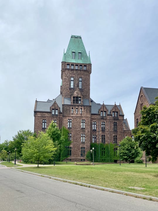 Richardsonian Romanesque Central Wing of the former Buffalo State Asylum with twin towers in Buffalo NY