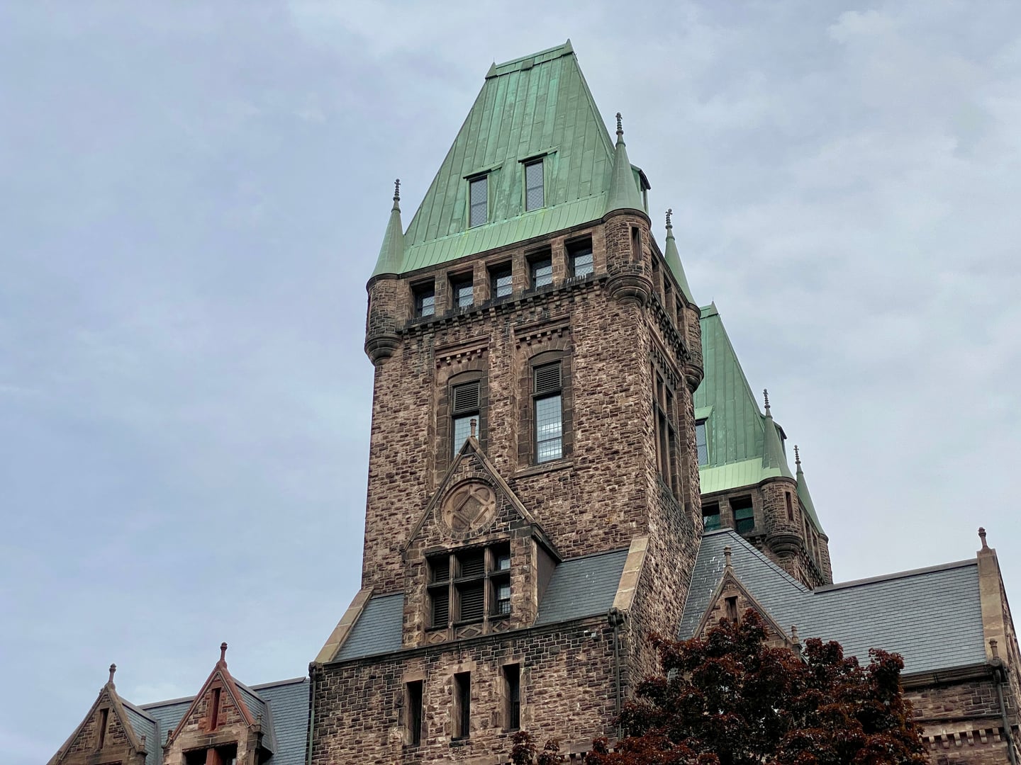 Central wing and Richardsonian-Romanesque twin towers of the Richardson Olmsted Campus (Buffalo State Asylum) in Buffalo, New York