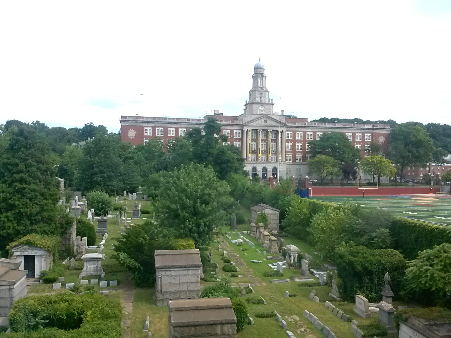Cypress Hills Cemetery with the Franklin K. Lane Educational Campus visible in the background, Brooklyn, New York