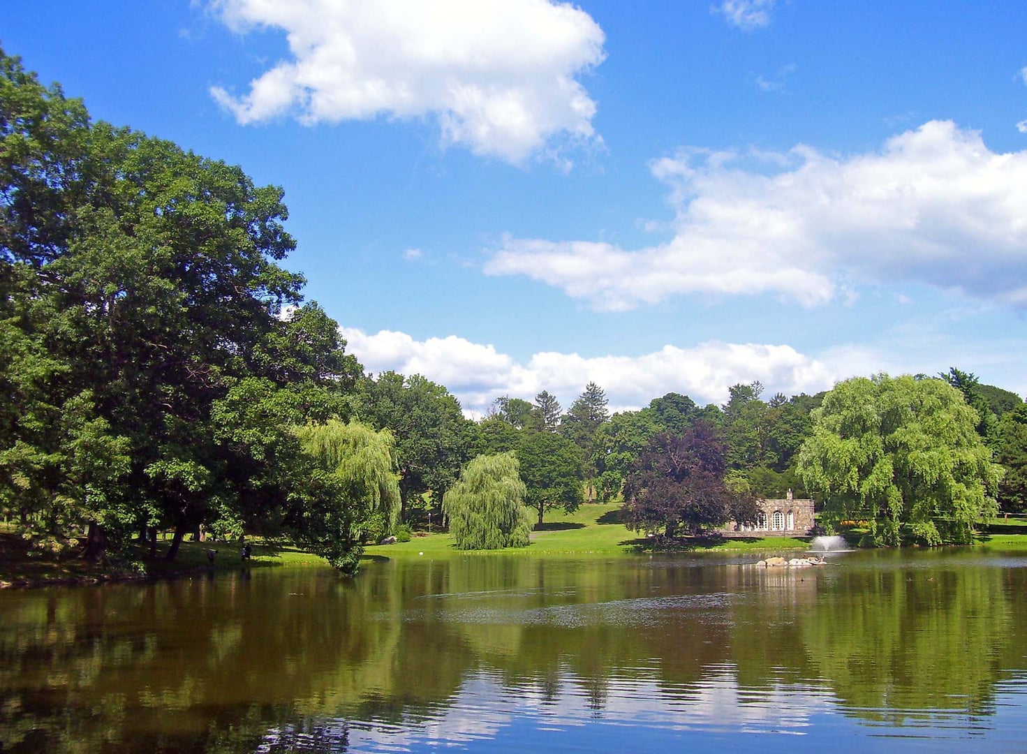 The pond and reflections at Downing Park in Newburgh, New York, the last Olmsted and Vaux collaboration