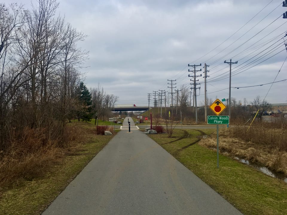 Looking northward along the Tonawanda Rail Trail from just before the crossing of Colvin Woods Parkway, with the Interstate 290 overpass in the distance, Tonawanda, New York, 15th January 2020.