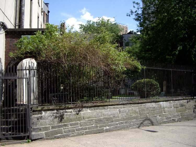 The First Shearith Israel Graveyard at 55 St. James Place in Chinatown, Manhattan—the oldest Jewish cemetery in New York City, established 1683, viewed through its iron gate.
