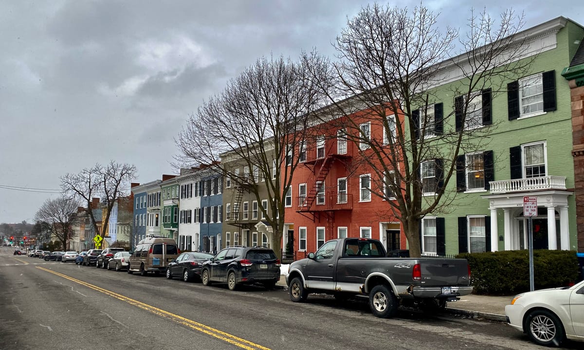 As seen in February 2022: an elegant and well-preserved procession of row houses lines the east side of South Main Street in Geneva, New York, part of the South Main Street Historic District. Listed on the National Register of Historic Places in 1974, the district encompasses a roughly mile-long str