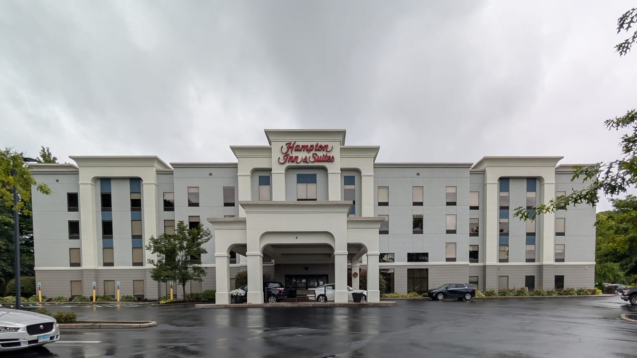 The front of the Hampton Inn and Suites with parking lot and entrance canopy. 4 West Oak Hill Road, Jamestown, New York 14701.