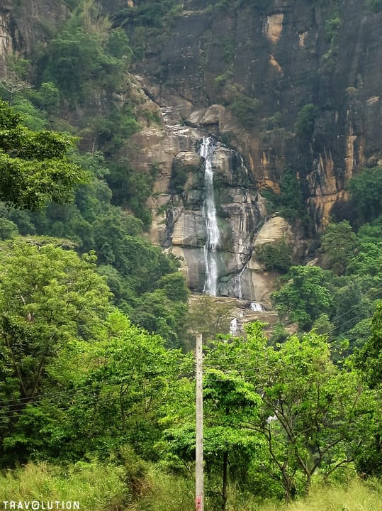 Ravana Falls, Ella, Hill Country, Sri Lanka

The falls have been named after the demon king Ravana, and is connected to the famous Indian epic Ramayana. According to the Ramayana, Ravana kidnapped princess Sitha and hid her in the caves behind the waterfall, now simply known as the Ravana Ella Cave.