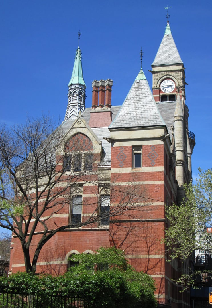 Victorian Gothic facade of the Jefferson Market Library at 425 Sixth Avenue in Greenwich Village, Manhattan, showing the clock tower.