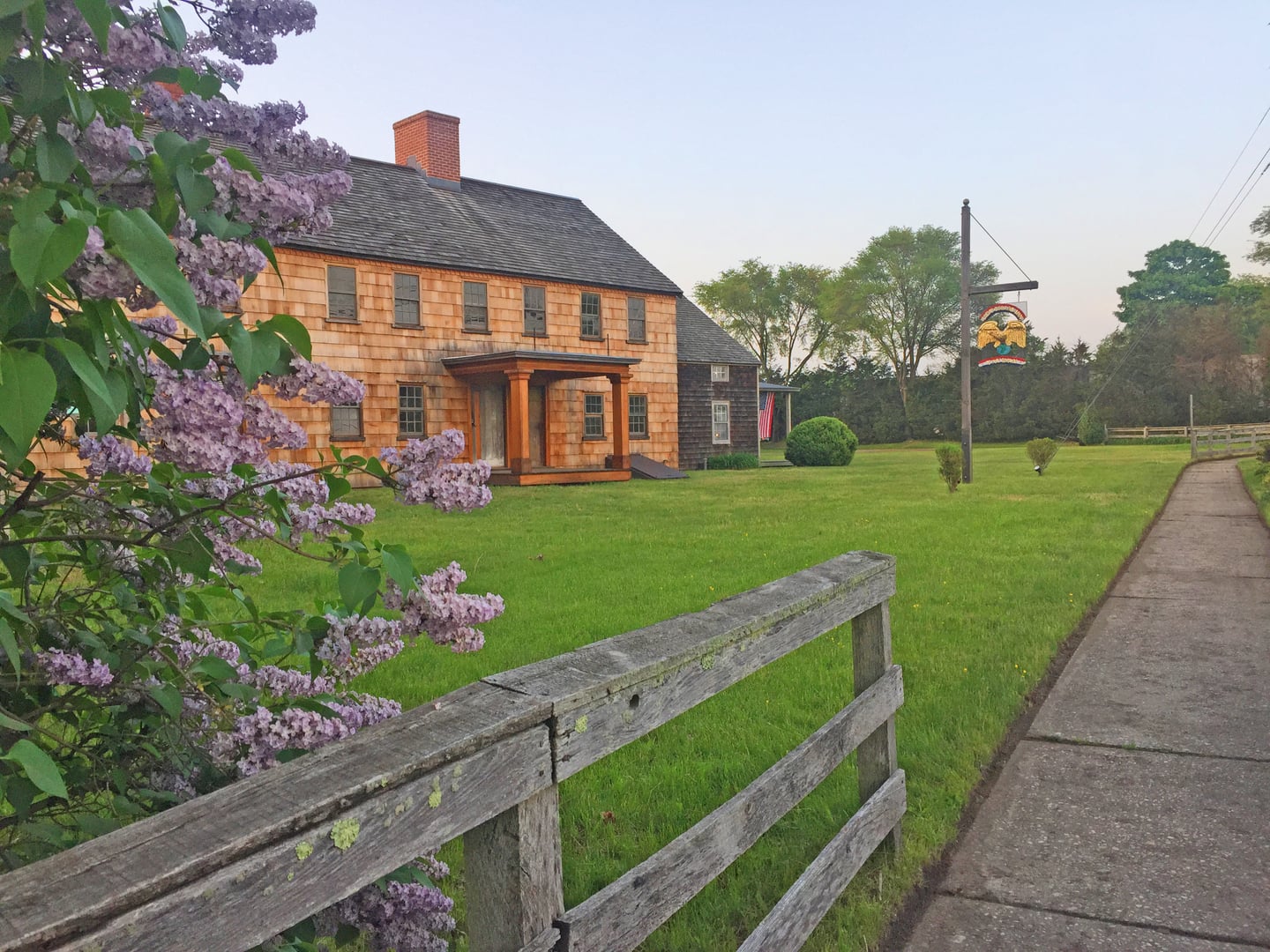 Front view of the Terry-Ketcham Inn, a colonial two-story timber-frame building in Center Moriches, New York