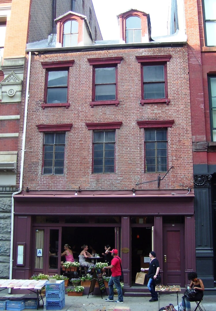 Federal-style 1817 building at 129 Spring Street between Greene and Wooster Streets in SoHo, Manhattan, site of the preserved Manhattan Well.