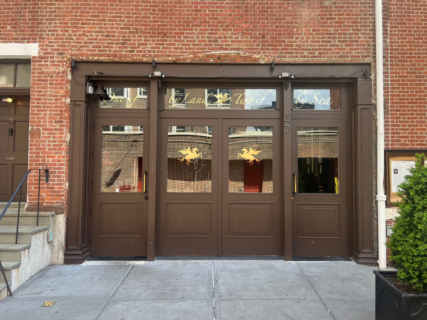 Brick facade of One If by Land, Two If by Sea restaurant at 17 Barrow Street in Greenwich Village, Manhattan, photographed in 2024.