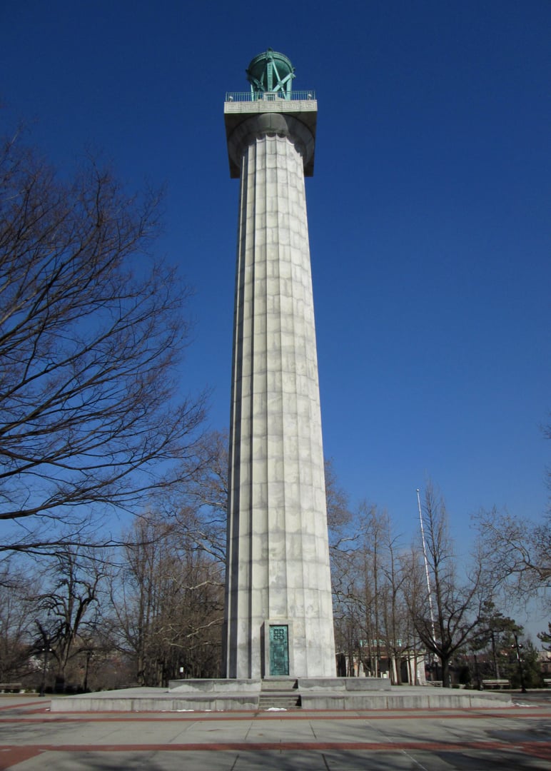 Prison Ship Martyrs' Monument in Fort Greene Park, Brooklyn — a 149-foot Doric granite column topped by a bronze brazier, photographed from the southwest in winter.