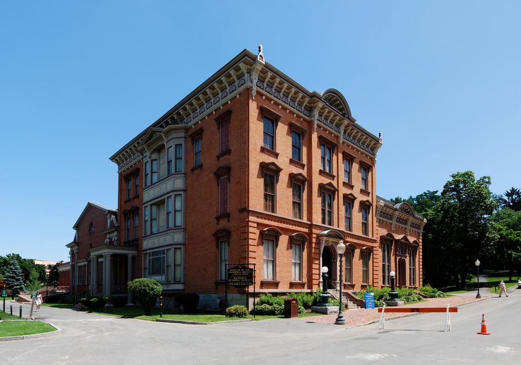 A wide panorama of the Canfield Casino's main building and east wing in Congress Park.
