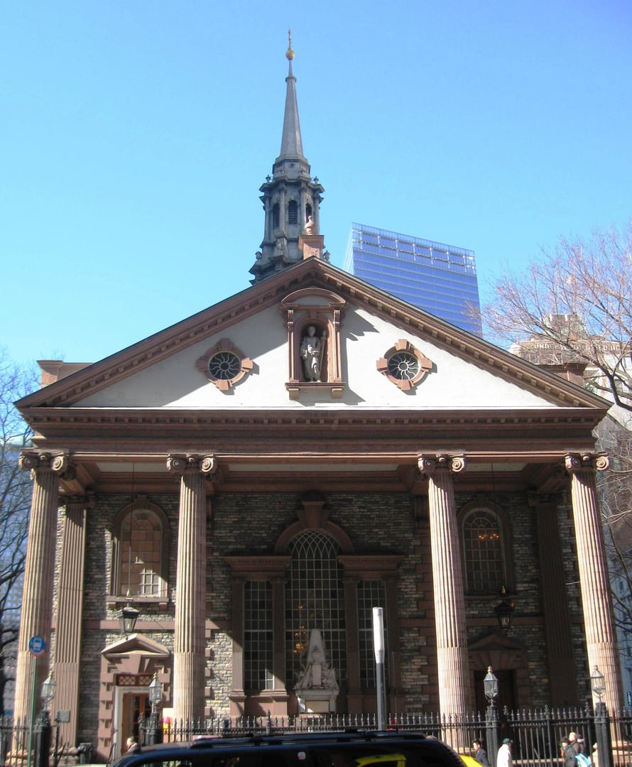 Exterior of St. Paul's Chapel on Broadway in Lower Manhattan, with the churchyard visible in the foreground
