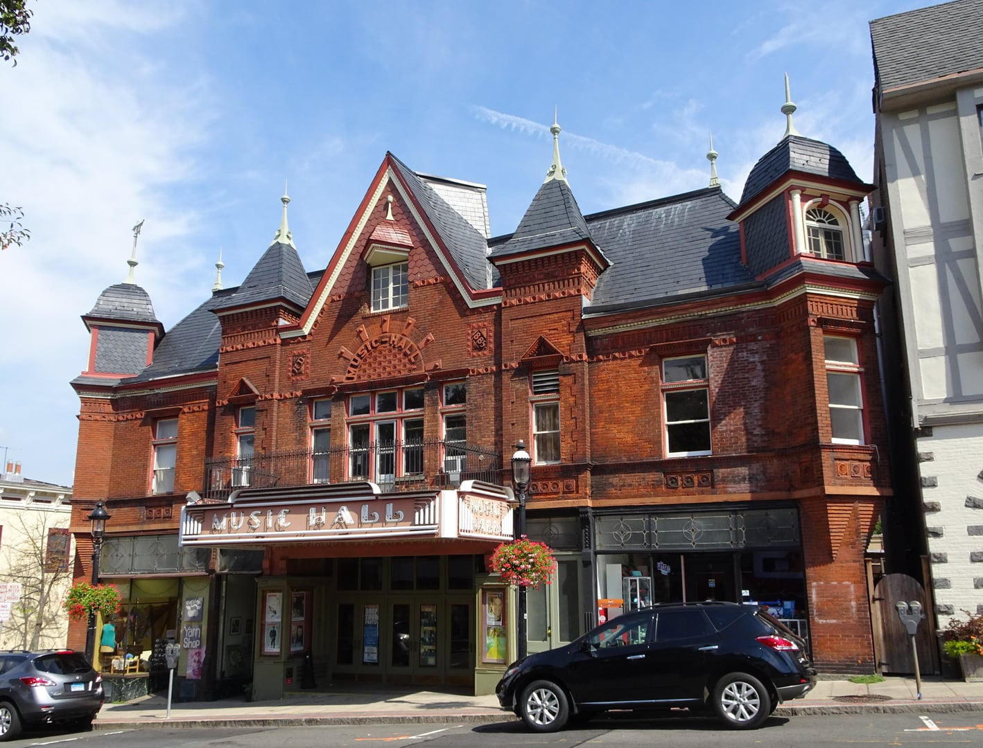 Exterior of the Tarrytown Music Hall, a brick Queen Anne theater built in 1885 on Main Street in Tarrytown, New York
