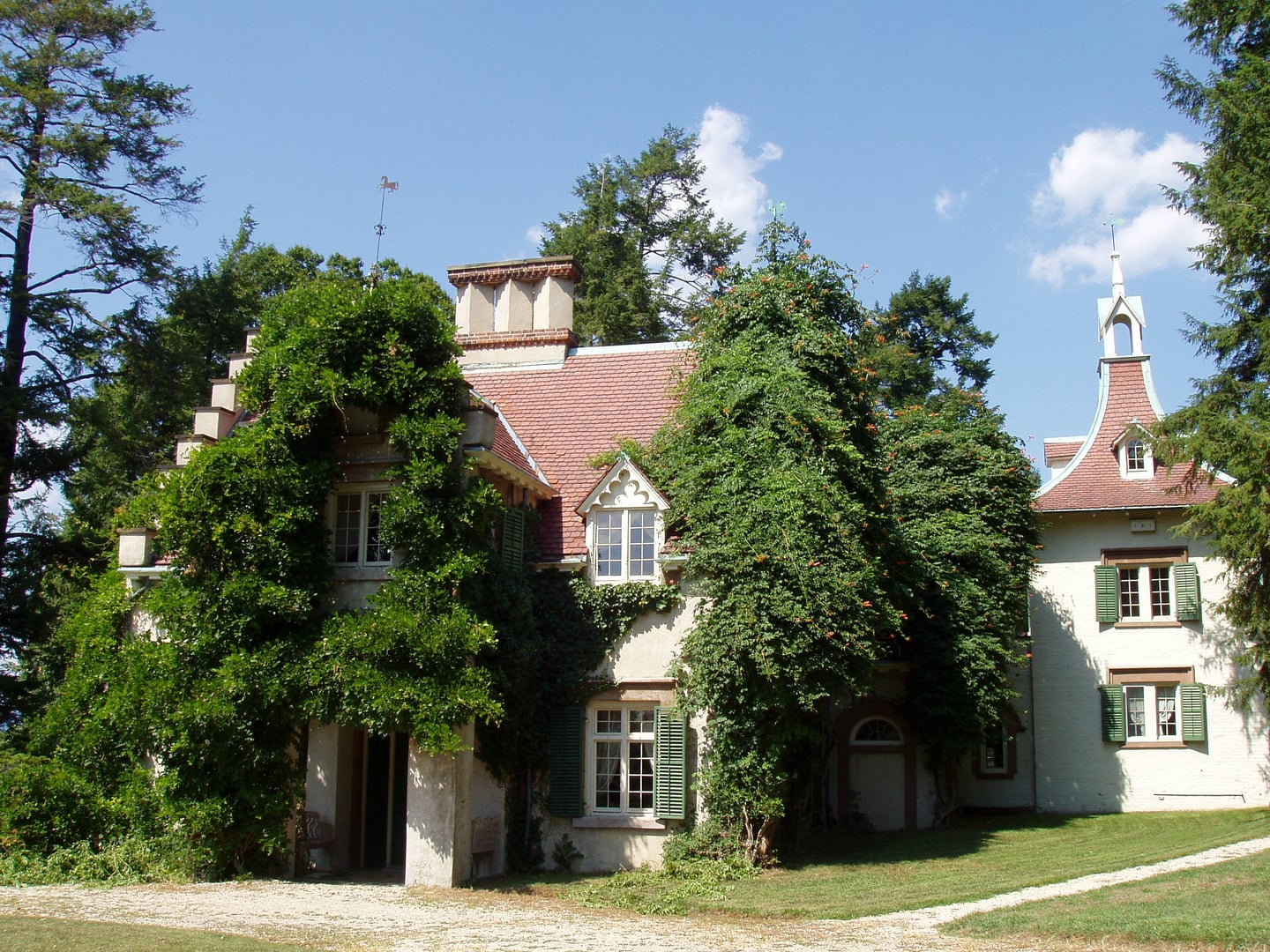 Exterior view of Washington Irving's Sunnyside cottage in Tarrytown, New York, showing the Dutch-style architecture and riverside grounds