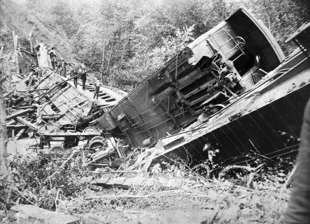 The wrecked locomotive and passenger car at the base of Bostian Bridge after the August 27, 1891 train disaster near Statesville, North Carolina.