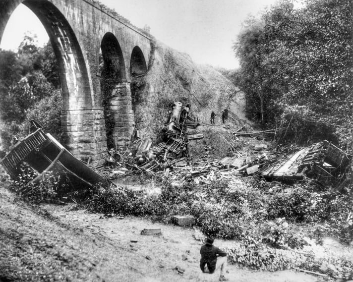 Locomotive and wooden passenger car wreckage at the base of Bostian Bridge over Third Creek near Statesville, North Carolina, after the August 1891 train disaster
