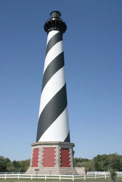 210-foot brick Cape Hatteras Lighthouse with its distinctive black-and-white spiral barber-pole stripes in Buxton, North Carolina