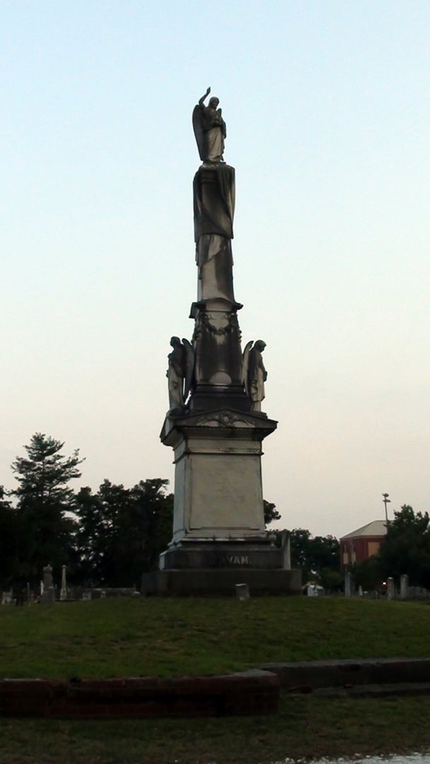 Our Dead monument standing among gravestones at Cedar Grove Cemetery in New Bern, North Carolina