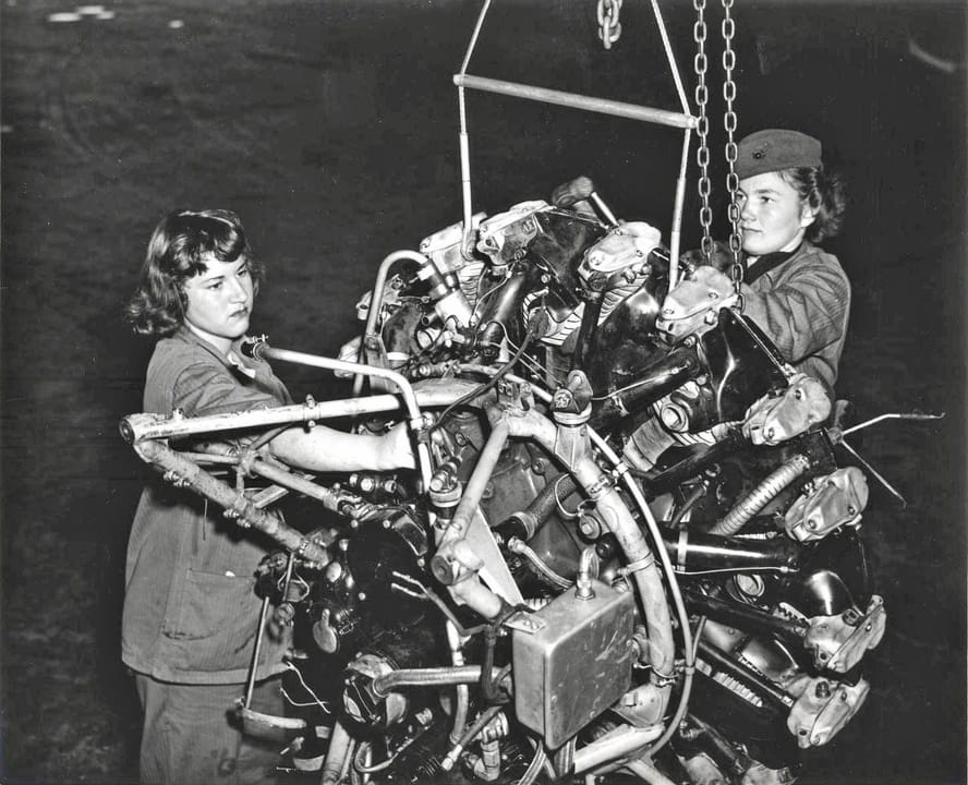 Private First Class Priscilla Goodrich (right) and Private Elaine Munsinger (left) break down an airplane engine in the Assembly and Repair Department at Marine Corps Air Station Cherry Point, North Carolina.From the Marine Corps Women's Reserve Collection (COLL/981) at the Marine Corps Archives &am