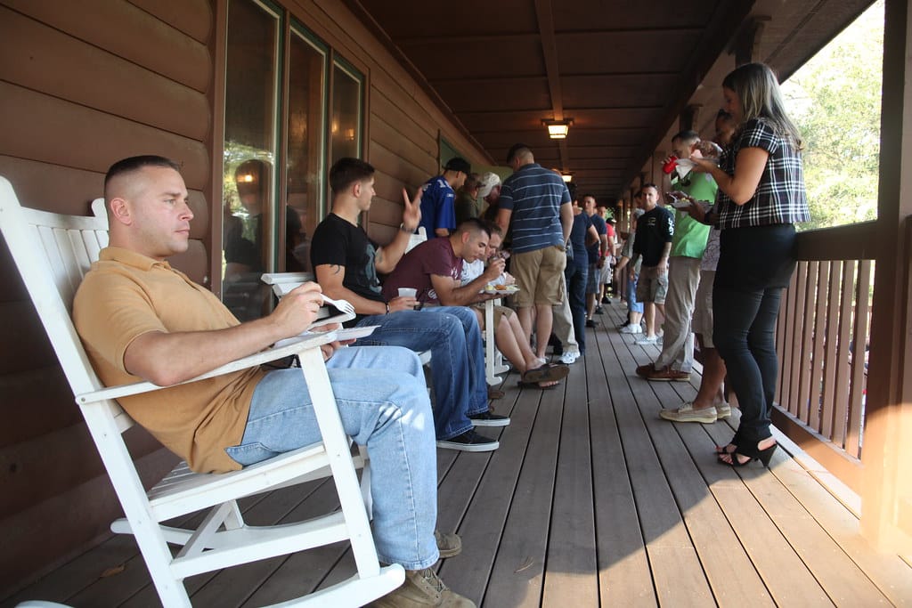 Marines, sailors and families enjoy the pork and potato salad during the quarterly Pig Pickin' at the Cherry Point Hancock Lodge Tuesday Sept. 27. The event congregated service members from both the Center for Naval Avionic Technical Training Marine Unit and Fleet Readiness Center East.