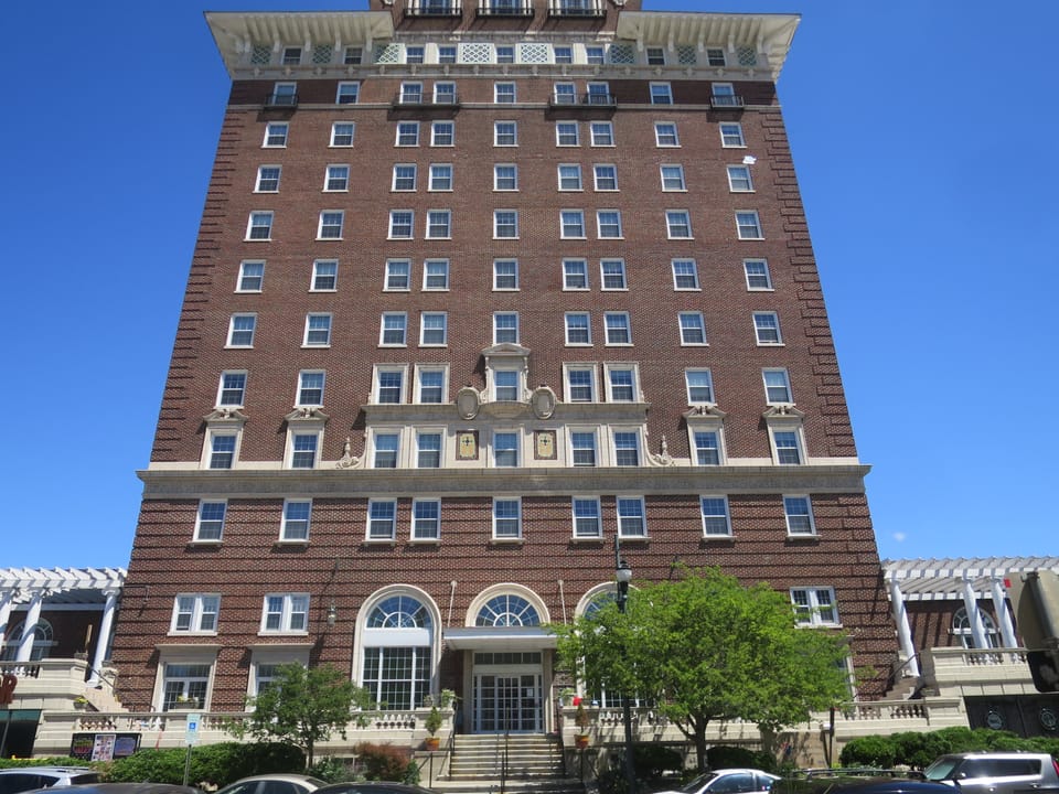 Symmetric front elevation of the Battery Park Hotel showing the ground-floor pergola and arched entrance, Asheville, North Carolina.