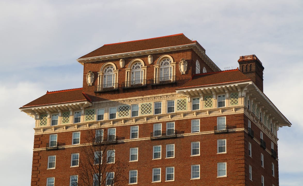 The distinctive penthouse-and-chimney crown atop the Battery Park Hotel, Asheville, North Carolina -- the former ballroom level, seen from street level.