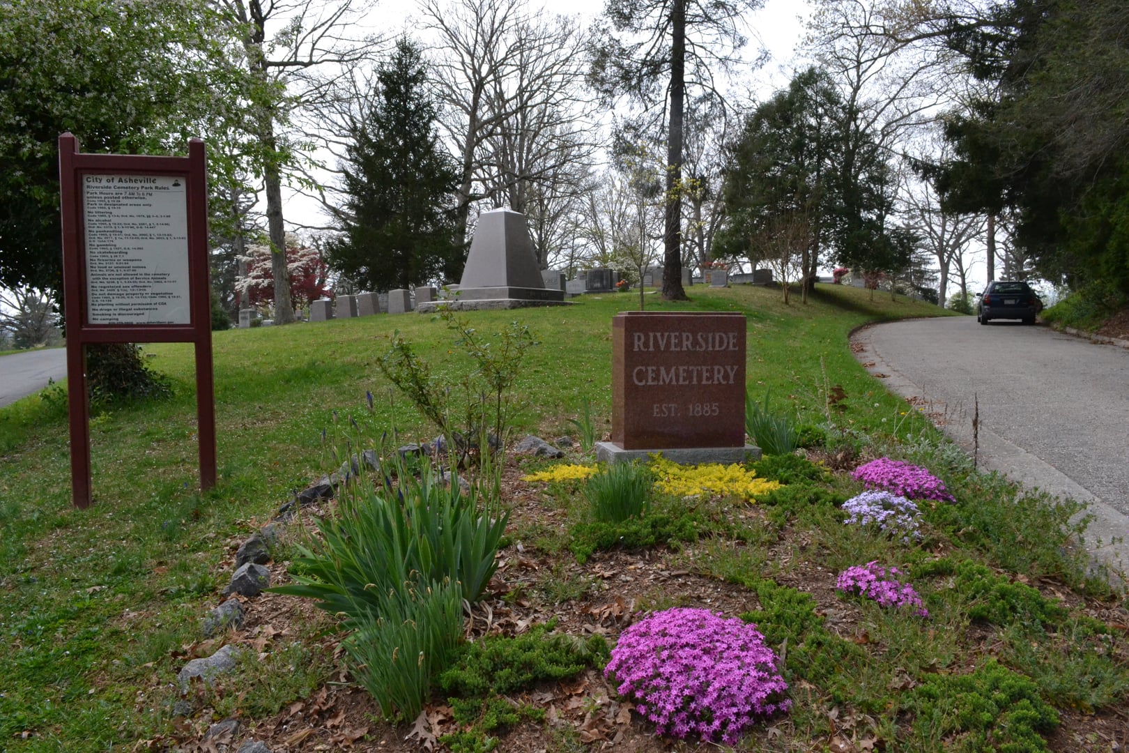 Headstones and shaded paths at Riverside Cemetery in Asheville, North Carolina, burial place of Thomas Wolfe and O. Henry.