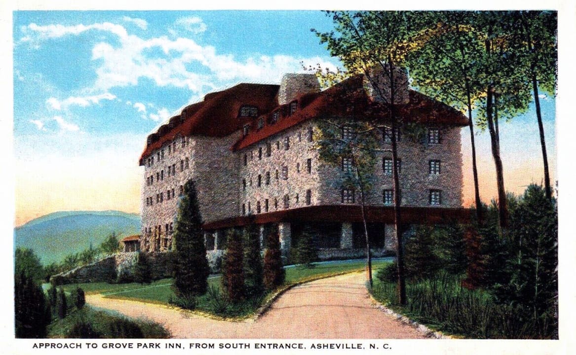Hand-tinted postcard, 'Approach to Grove Park Inn, from South Entrance, Asheville, N.C.', showing the hotel's stone-and-red-tile-roof facade from the approach drive among trees, published 1914.