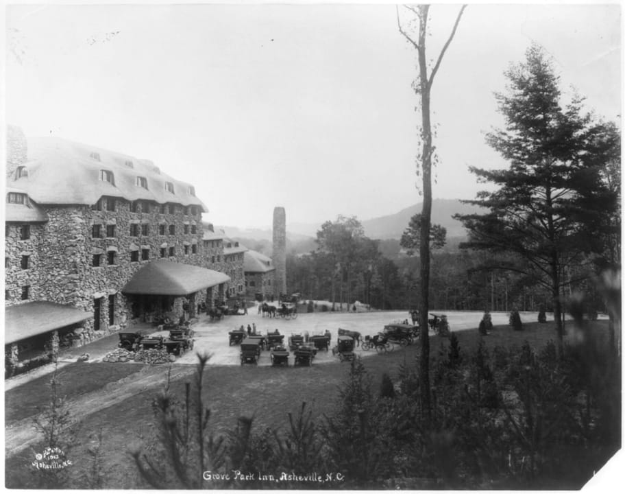 The Grove Park Inn, Asheville, N.C., photographed by Herbert W. Pelton, copyrighted December 1913, shortly after the hotel's July 1913 opening -- full exterior with period automobiles and carriages at the entrance drive.