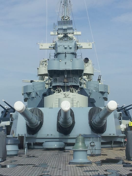 Close head-on view of the forward 16-inch gun turrets of the USS North Carolina, deck-level, Wilmington, North Carolina.