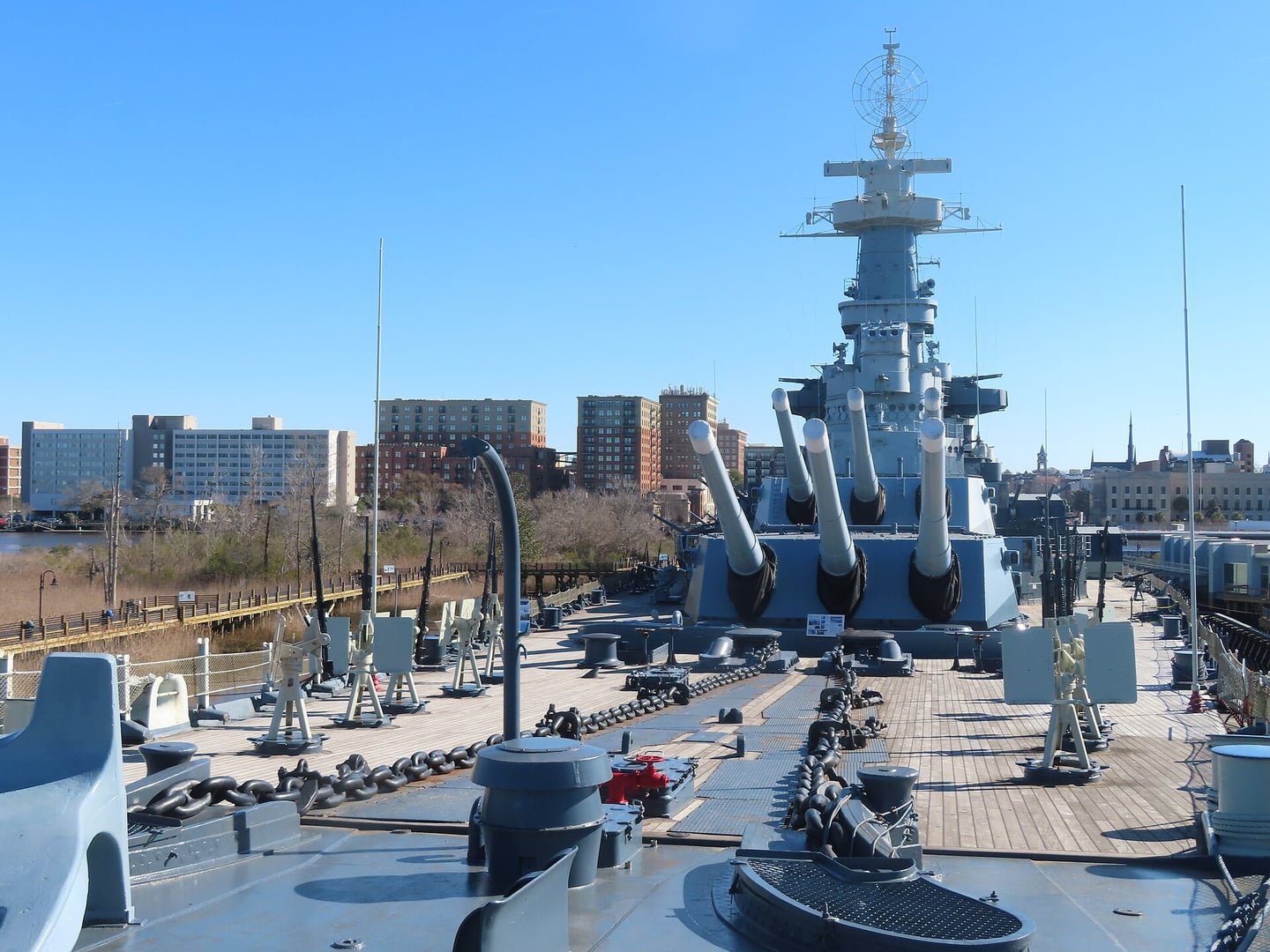 USS North Carolina battleship (BB-55) moored on the Cape Fear River in Wilmington, NC, photographed February 2023 with its 16-inch gun turrets and superstructure visible