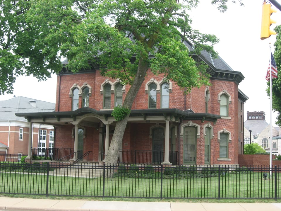 Front and northern side of the Andrew Jackson House (now offices for a philanthropic foundation), located at 277 E. Mill Street in Akron, Ohio, United States.  Built in 1870, it is listed on the National Register of Historic Places.