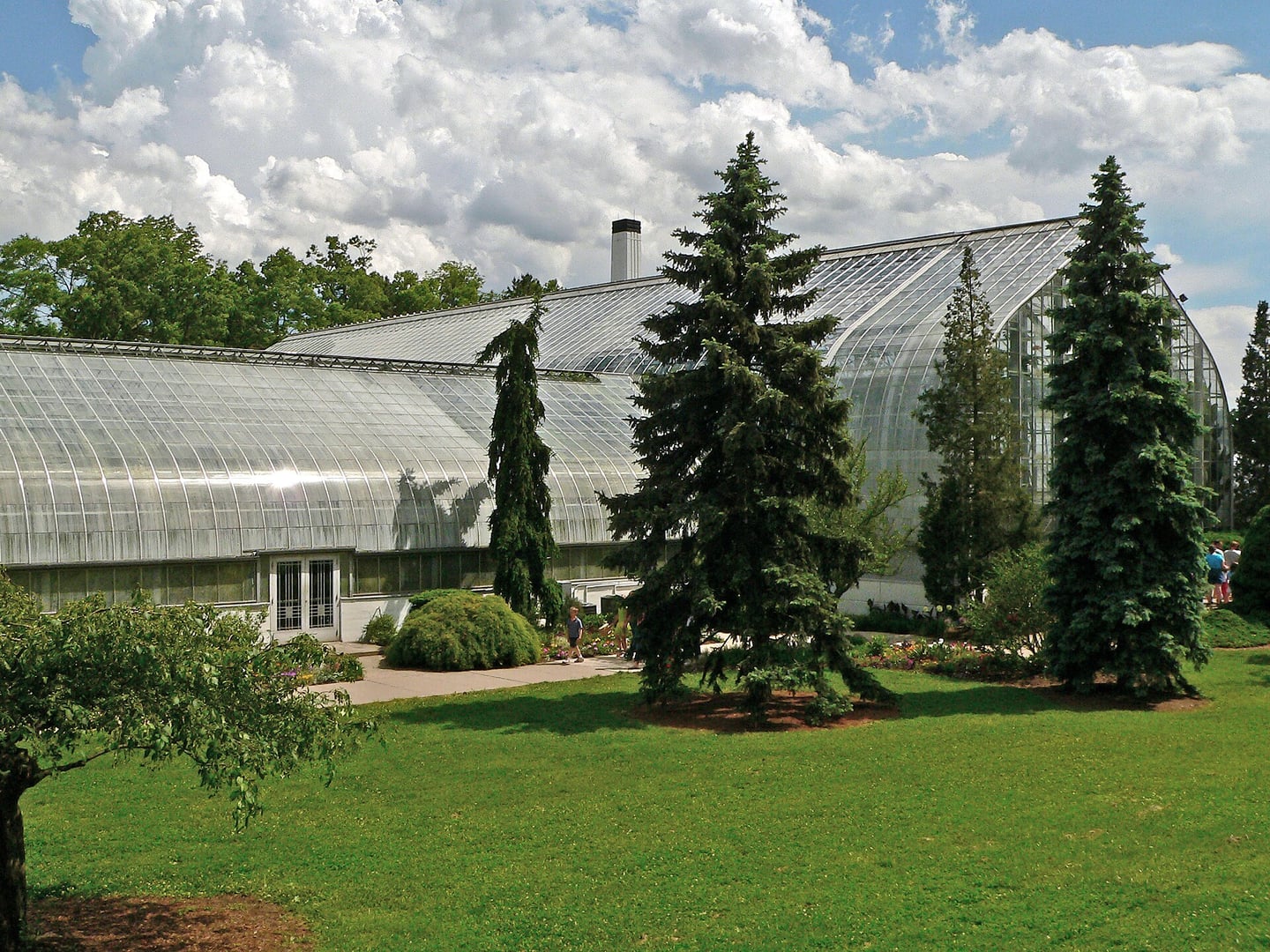 Exterior of Krohn Conservatory's Gothic-arched Art Deco glass facade in Eden Park, Cincinnati, Ohio