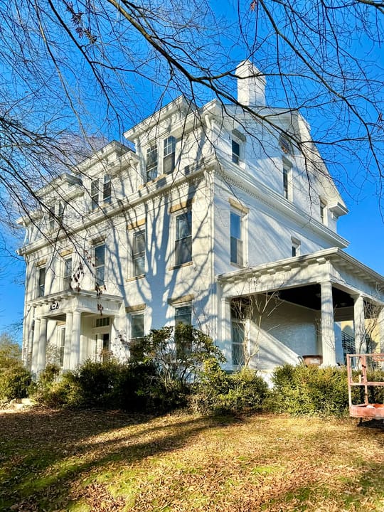 Built in 1855, this Greek Revival and Classical Revival-style house was built for W. P. Skinner, and was later the home of George White, whom was the governor of Ohio from 1931 until 1934.  The house is clad in painted brick with a side-gable roof, one-over-one windows, a two-story rear ell, a stone