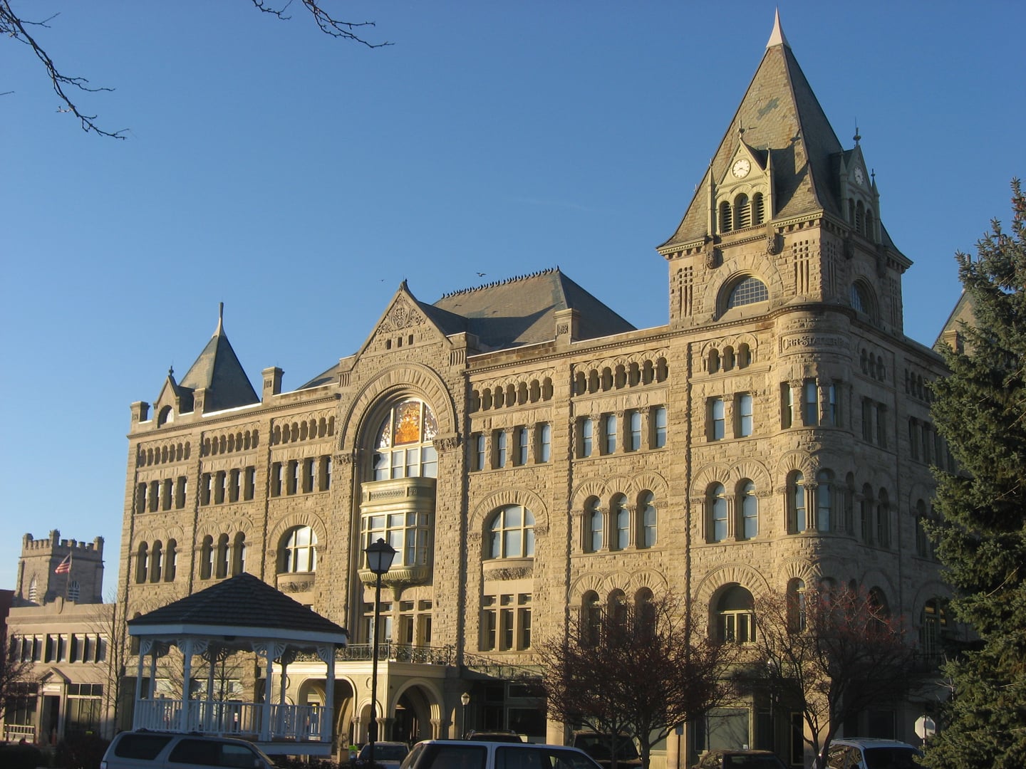 Richardsonian Romanesque facade and clock tower of Fort Piqua Plaza, the 1890 former hotel now housing Piqua Public Library, Piqua, Ohio.