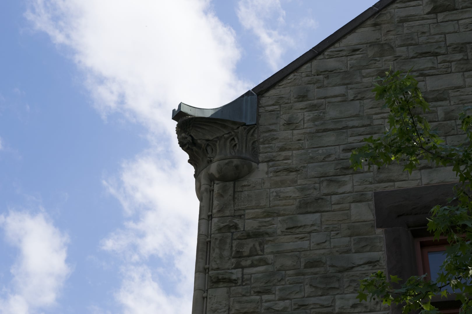 Orton Hall's stone Romanesque facade and bell tower on the OSU South Oval