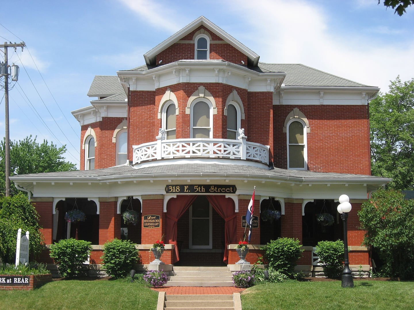 Front facade of the 1884 Dr. David W. Henderson House at 318 E. Fifth Street in Marysville, Ohio, now operating as the House of Spirits cocktail bar and on the National Register of Historic Places