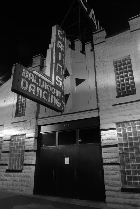 Cain's Ballroom's illuminated sign and entrance at night